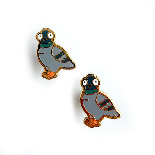 Pigeon shaped stud earrings with gold details.