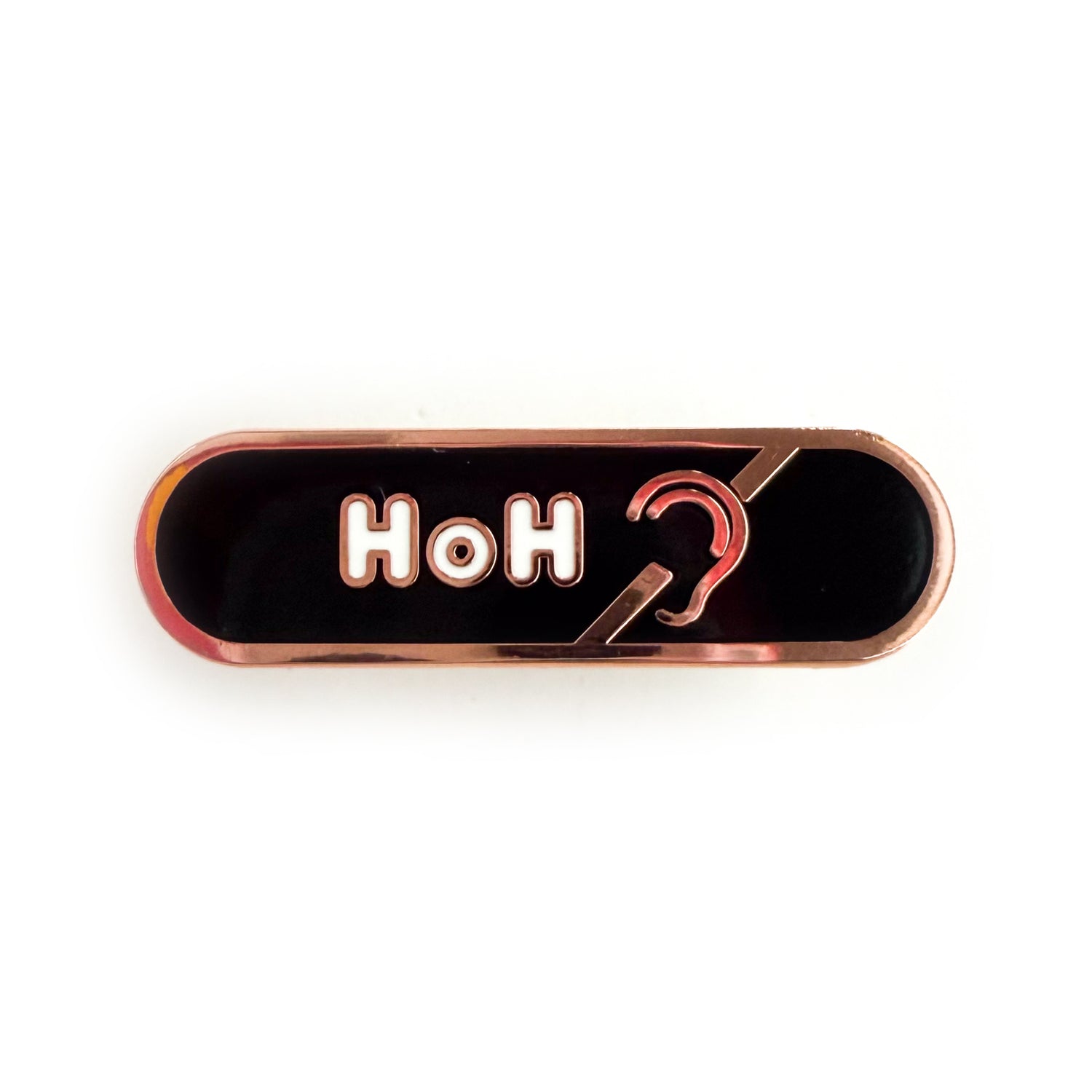 A bandaid shaped pin with the text HoH in bubble letters and the hard of hearing symbol. The background is black and the text is white.