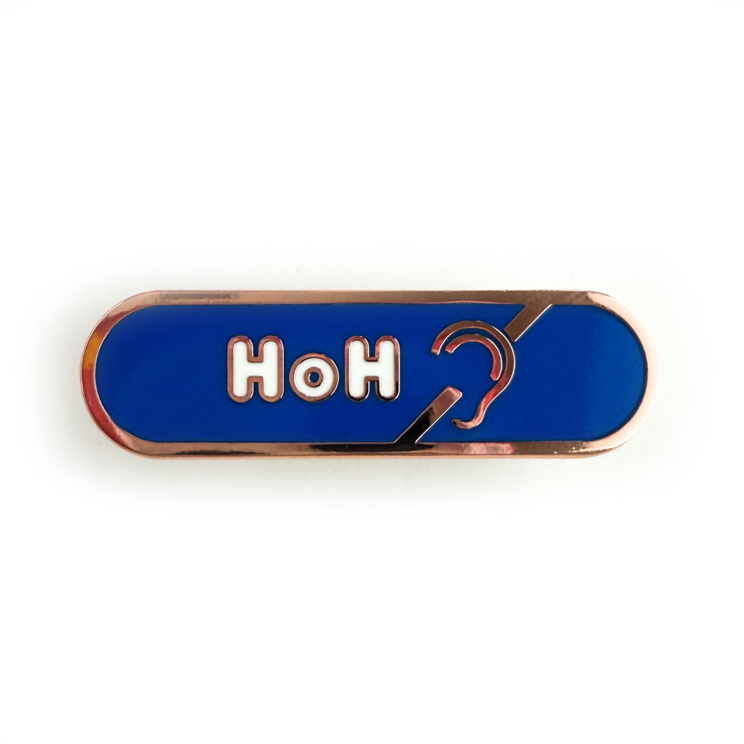 A bandaid shaped pin with the text HoH in bubble letters and the hard of hearing symbol. The background is blue and the text is white.