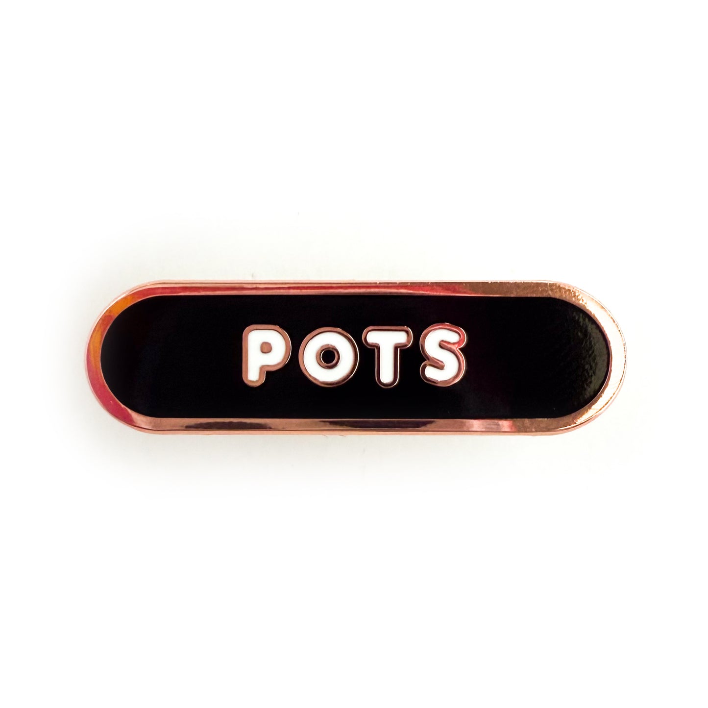 A bandaid shaped pin with the text POTS in bubble letters. The background is black and the text is white.