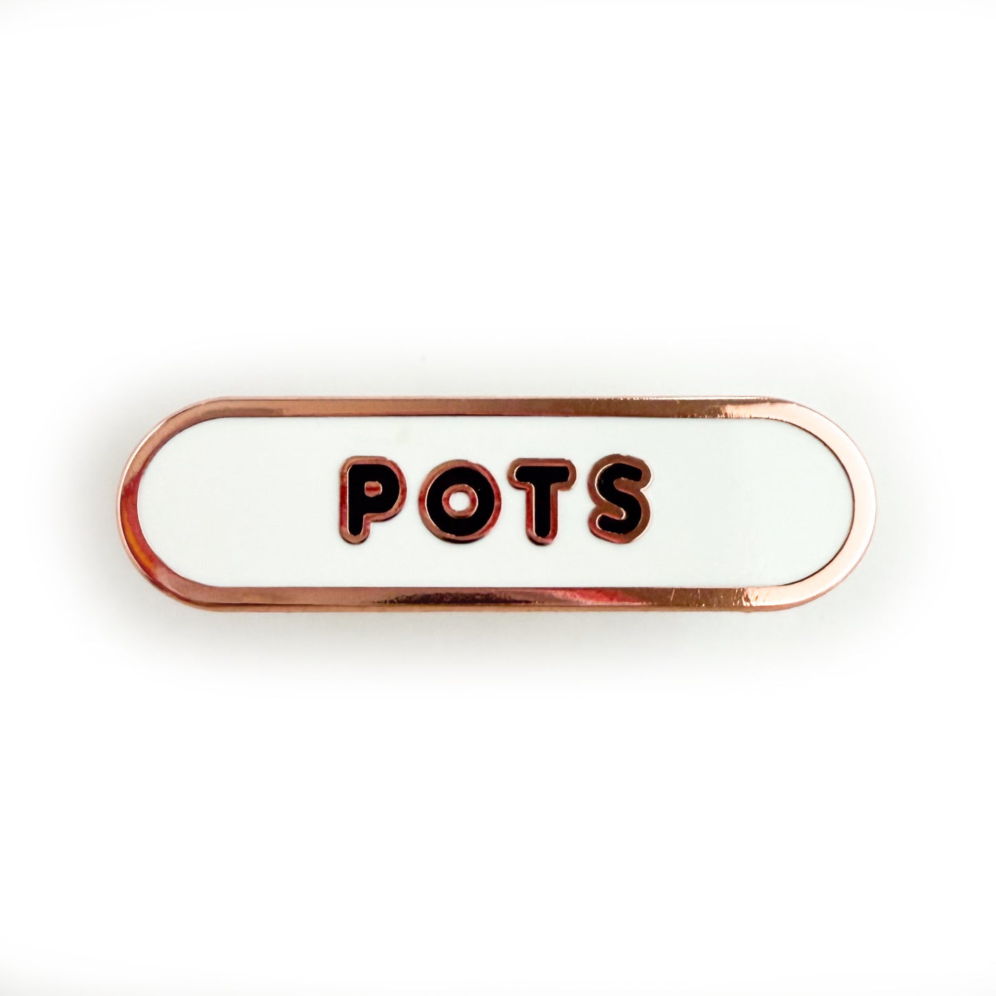 A bandaid shaped pin with the text POTS in bubble letters. The background is white and the text is black.