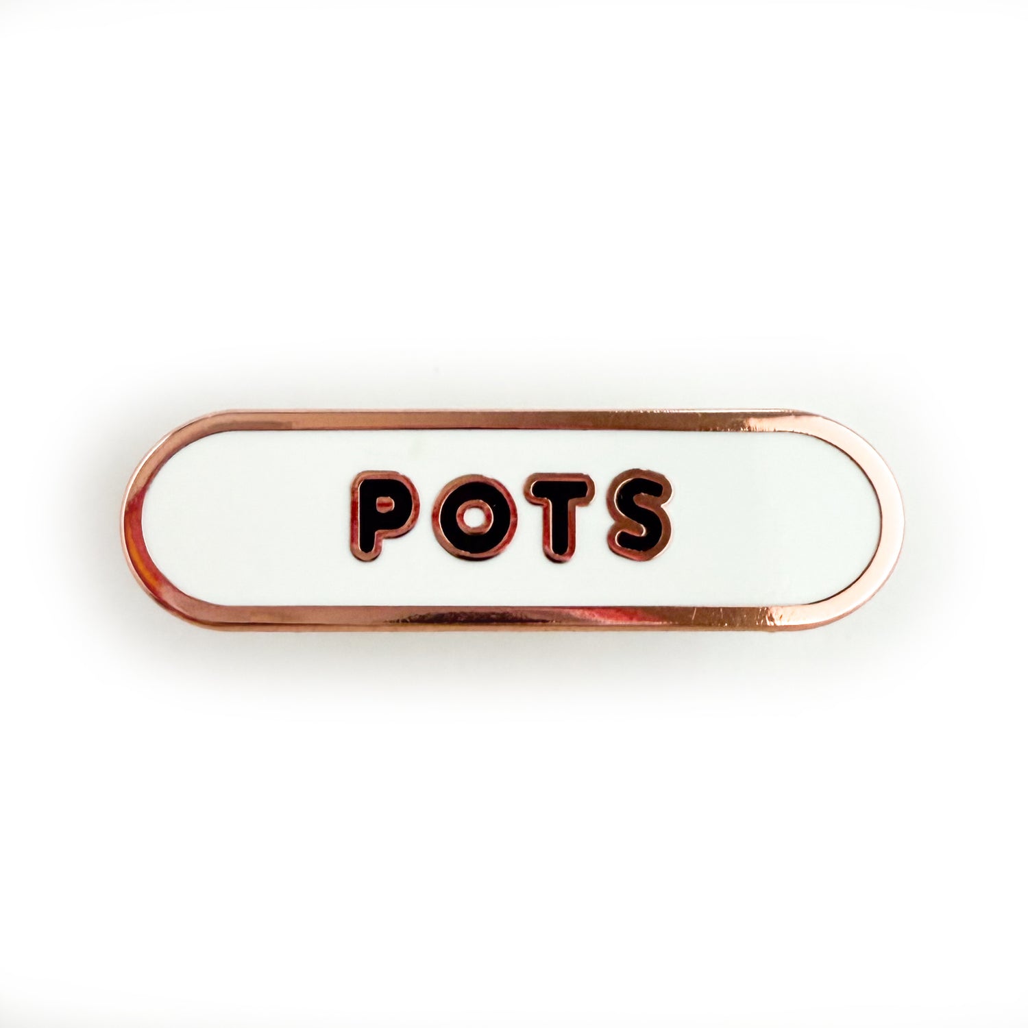 A bandaid shaped pin with the text POTS in bubble letters. The background is white and the text is black.