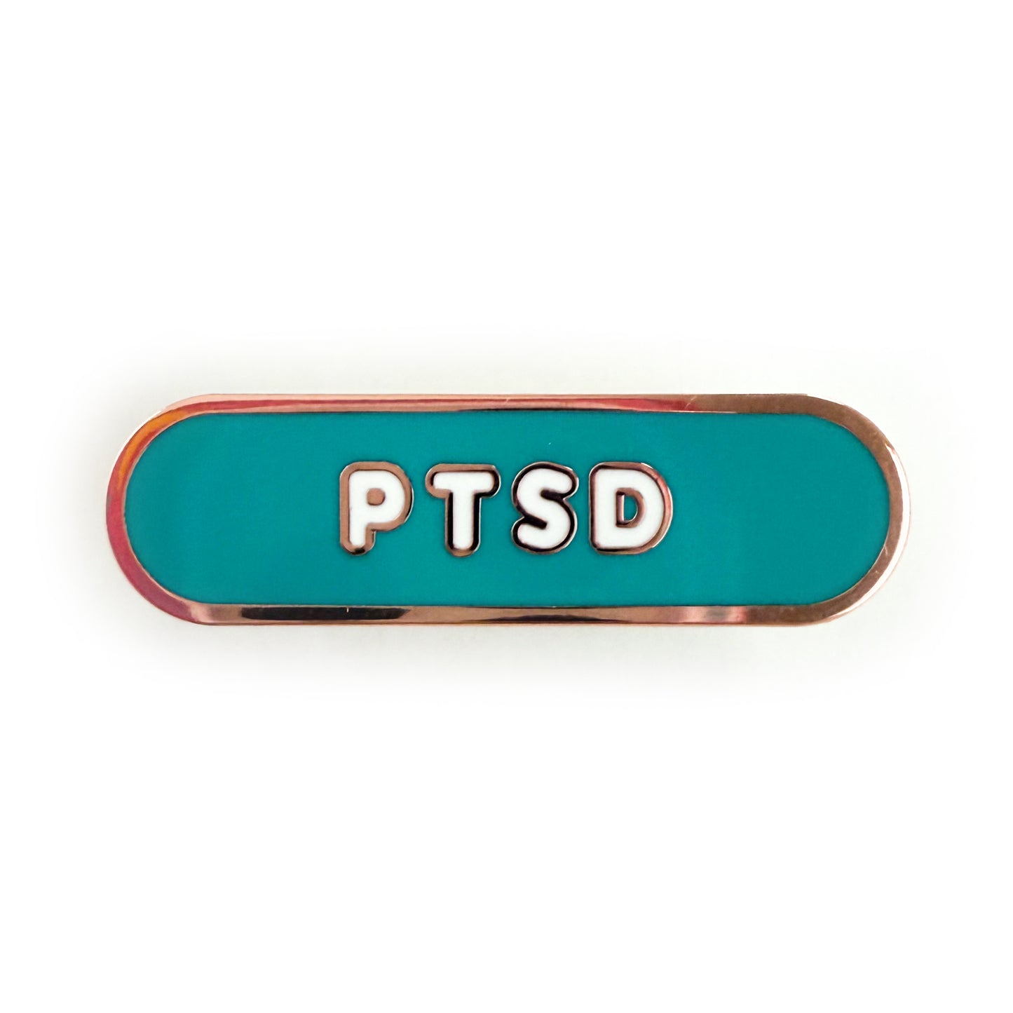 A bandaid shaped pin with the text PTSD in bubble letters. The background is teal and the text is white.
