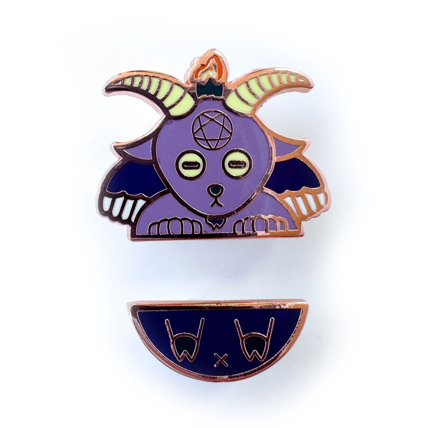 Two enamel pins representing Baphomet, one is the top part with the goat head, hands and wings, the other is the butt with hoof feet.