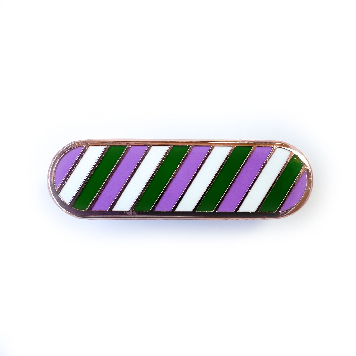 An enamel pin in the shape of a capsule with diagonal stripes of purple, green, and white, representing the Genderqueer pride flag.