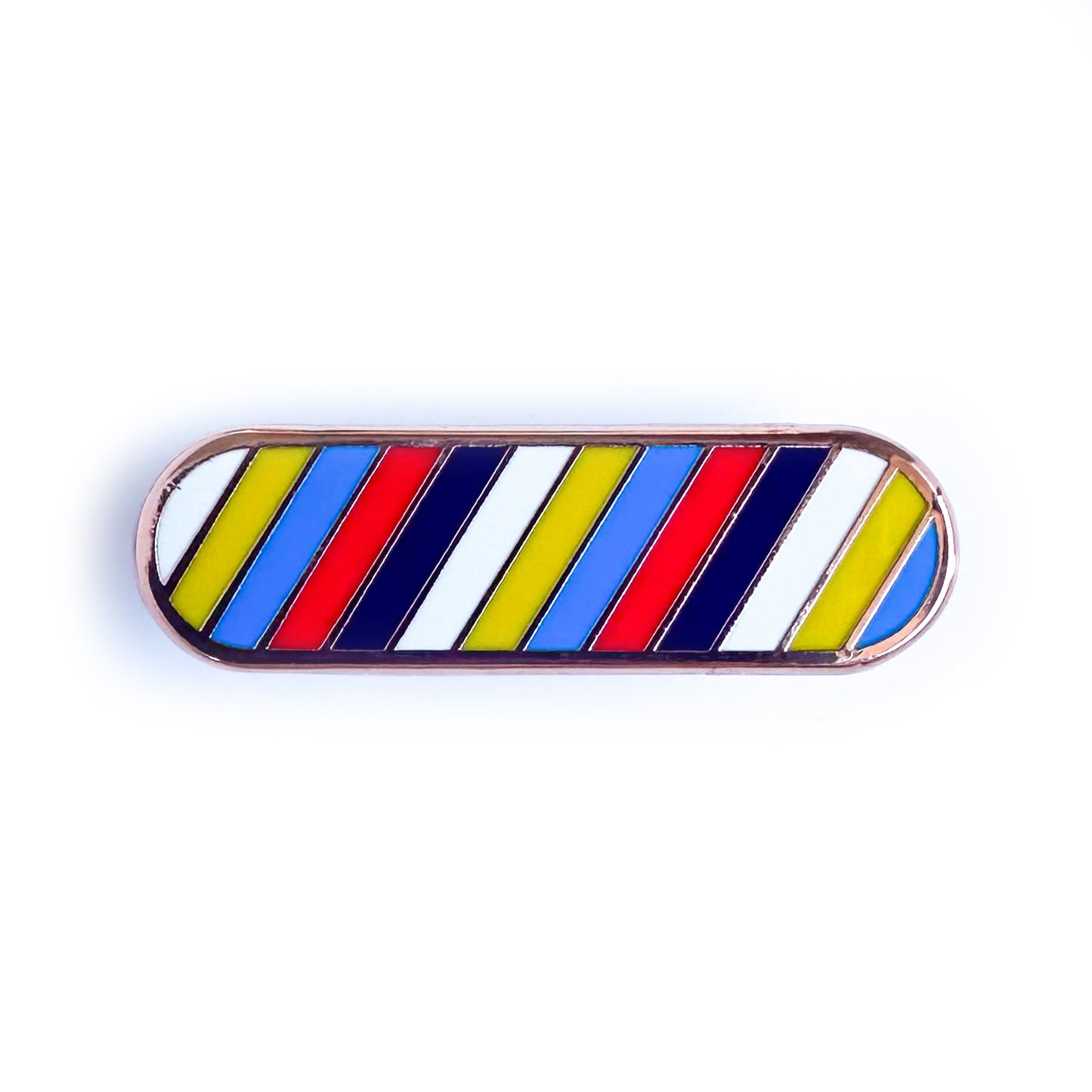 A capsule shaped enamel pin with the colors of the new Polyamorous Pride Flag on it in diagonal stripes.
