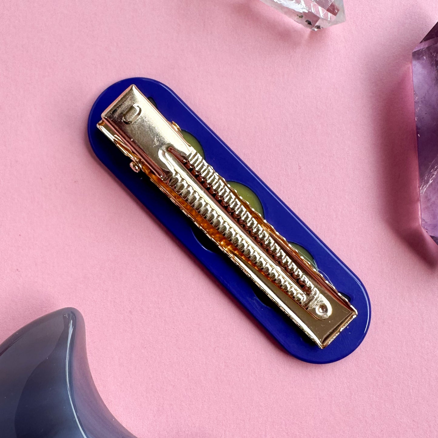 The back of the moon phase hair clip with a gold colored alligator style hair clip.