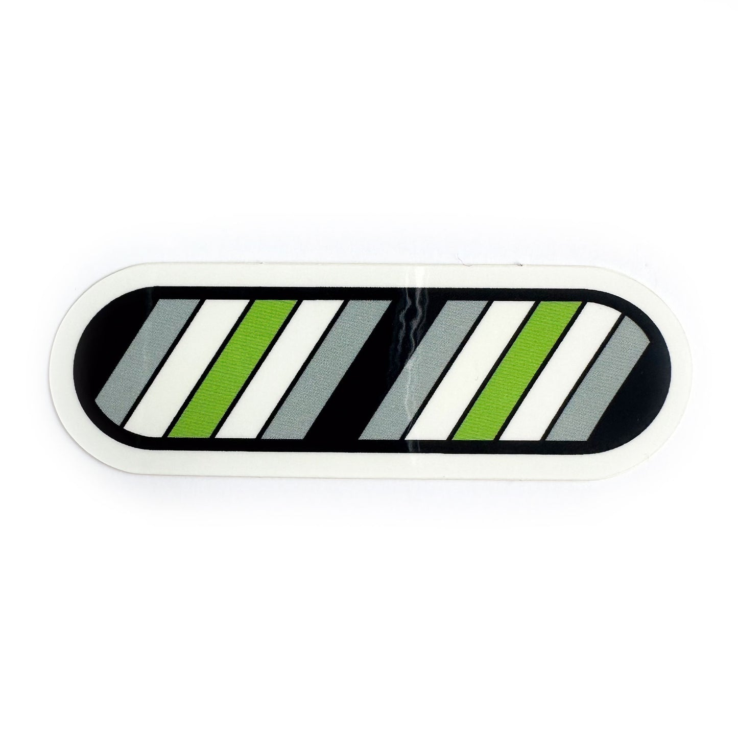 A vinyl sticker in the shape of a capsule with diagonal lines in the color of the Agender flag
