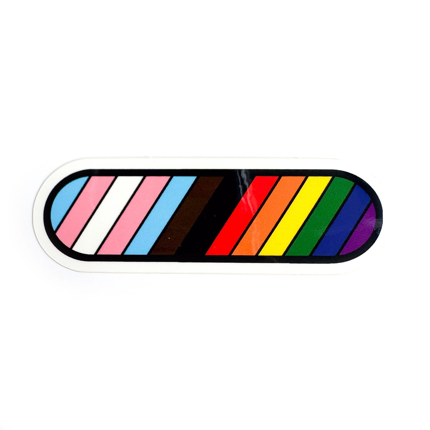 A capsule shaped vinyl sticker with the colors of the inclusive pride flag in diagonal stripes on it.