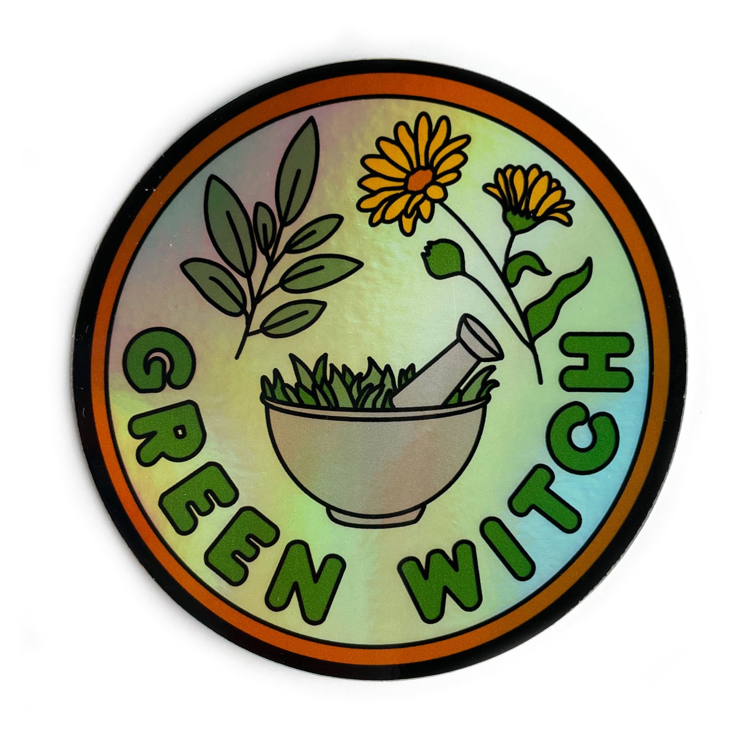 A circular holographic sticker that has an orange border and the words "Green Witch" on it. Sage leaves, calendula flowers, and a mortar and pestle are depicted on it.