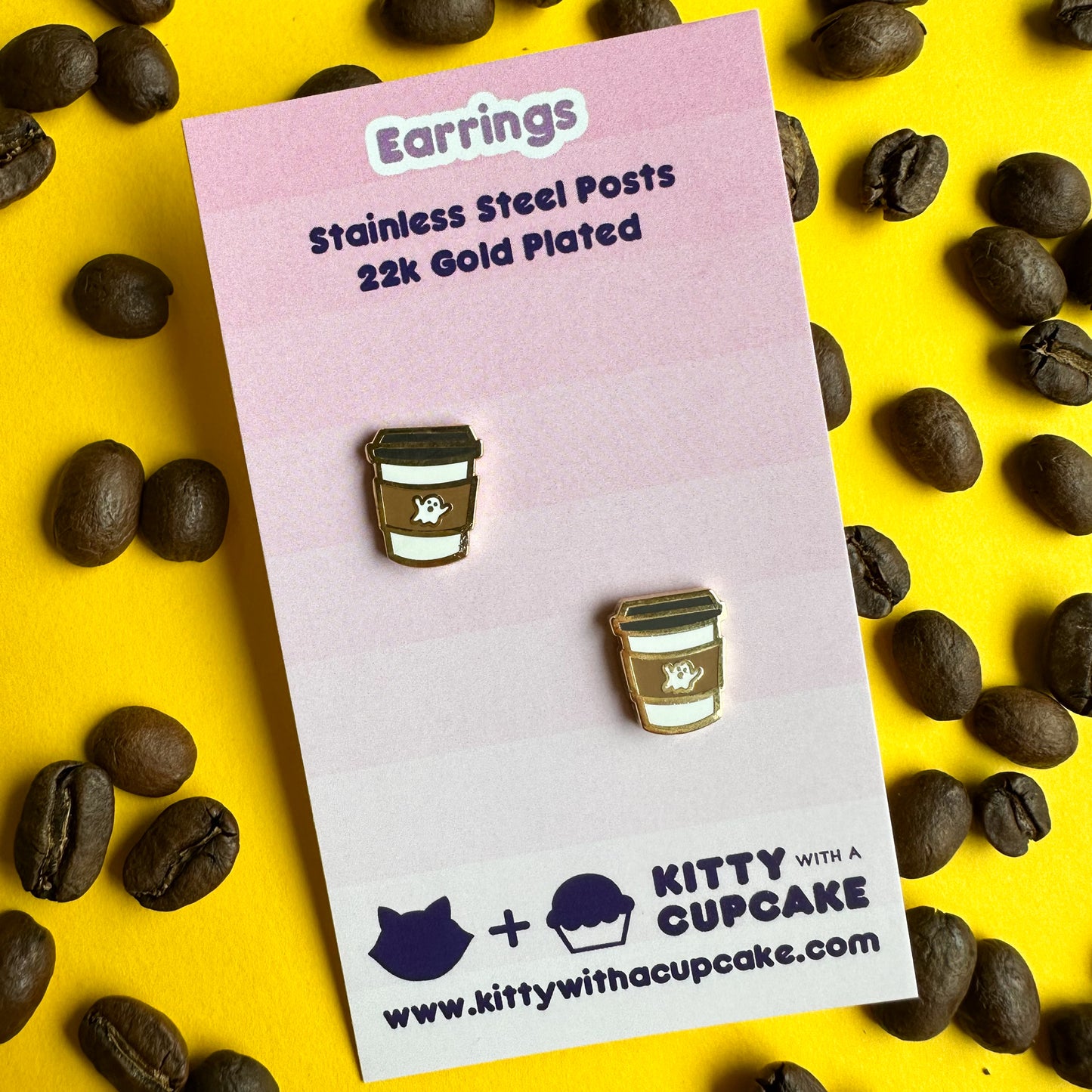 Ghost coffee cup earrings packaged on a pink card