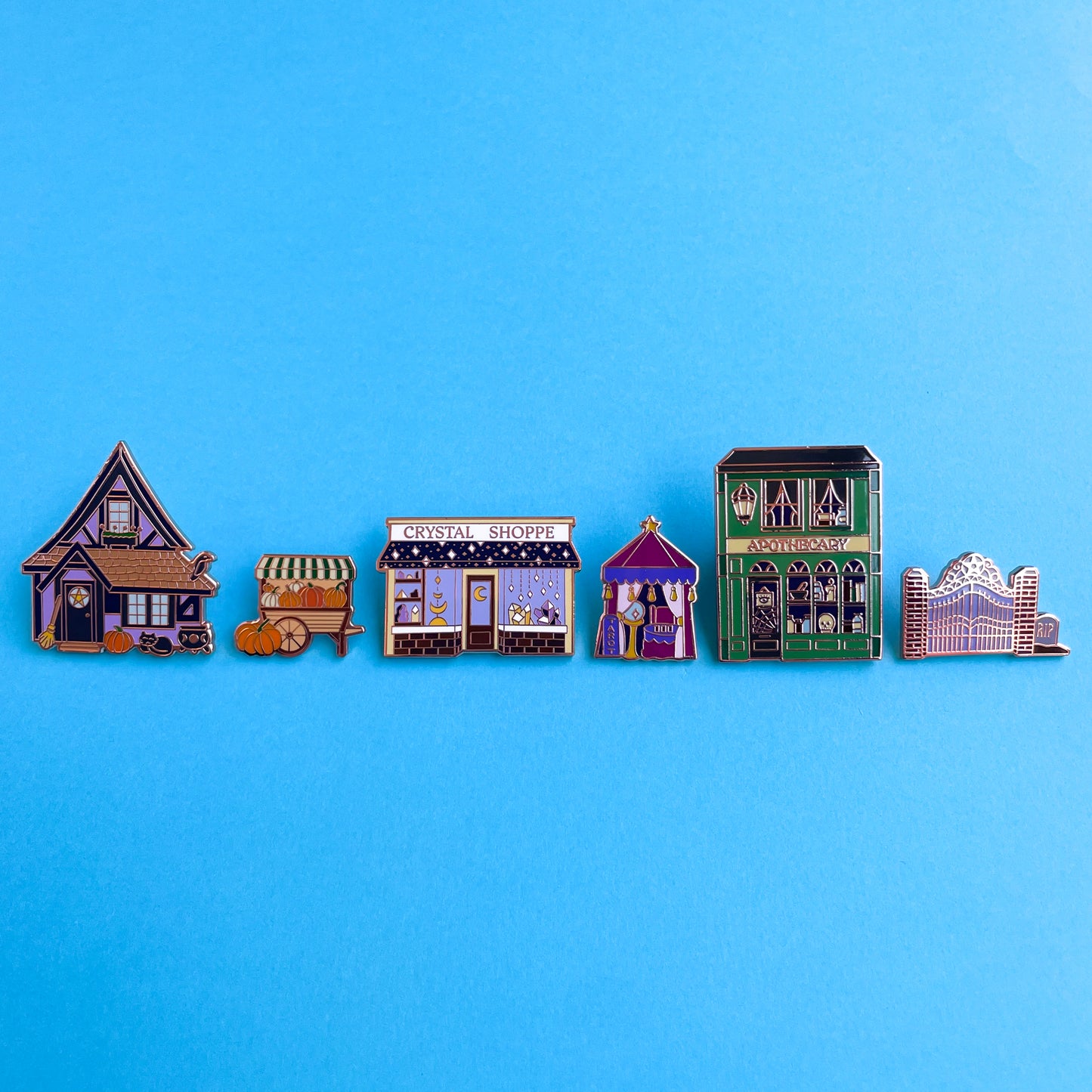 The full magical town square pin set displayed on a blue background