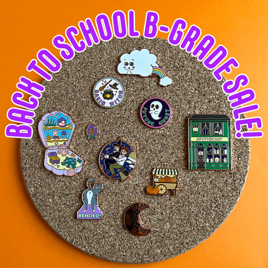 Graphic displaying different b-grade pins on a cork board. The background is a bright orange. At the top in purple text outlined in white says, "Back To School B-Grade Sale!"