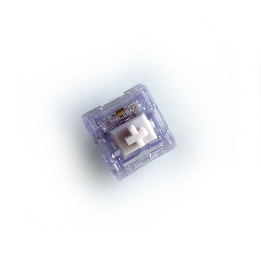 A linear keyboard switch on a white background. The switch component is white, and the casing is a translucent purple with sparkles.