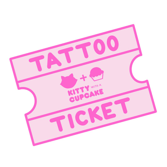 A pink illustration of an arcade style ticket that reads "Tattoo Ticket" with the kitty With A Cupcake logo in the center.
