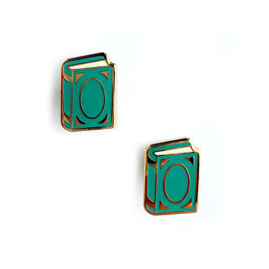 Teal book shaped earrings with gold accents on a white background