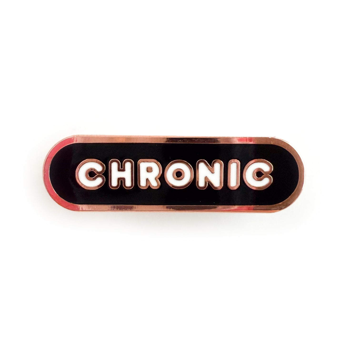 A bandaid shaped pin with the text CHRONIC in bubble letters. The background is black and the text is white.