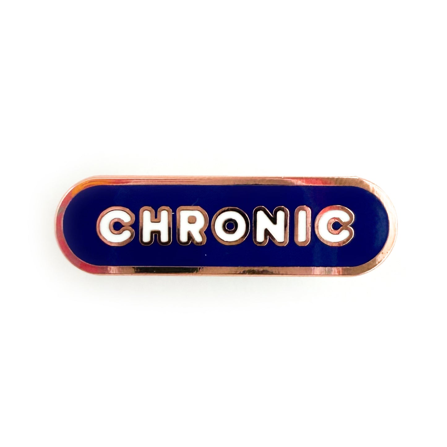 A bandaid shaped pin with the text CHRONIC in bubble letters. The background is violet and the text is white.