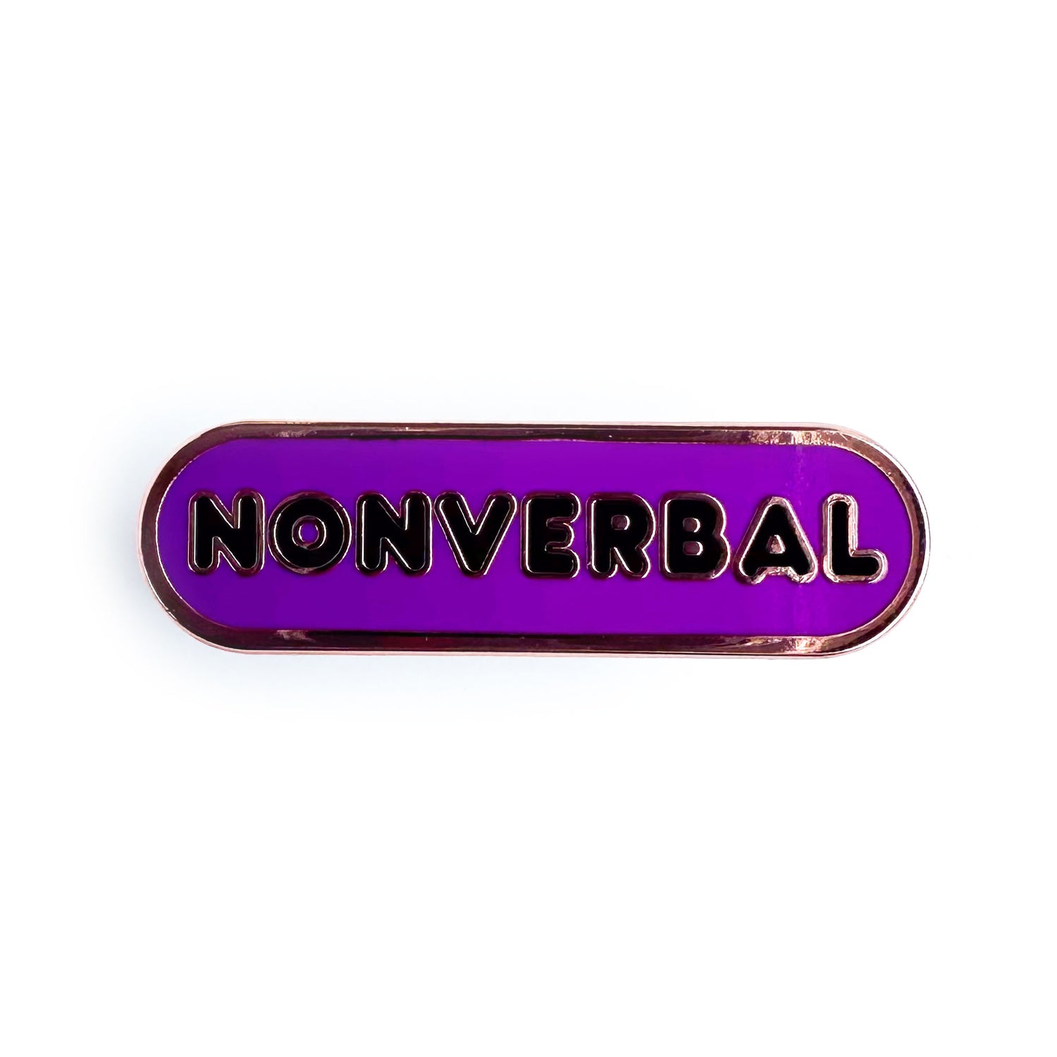 A purple lapel pin with the word "Nonverbal" on it in black bubble letters.