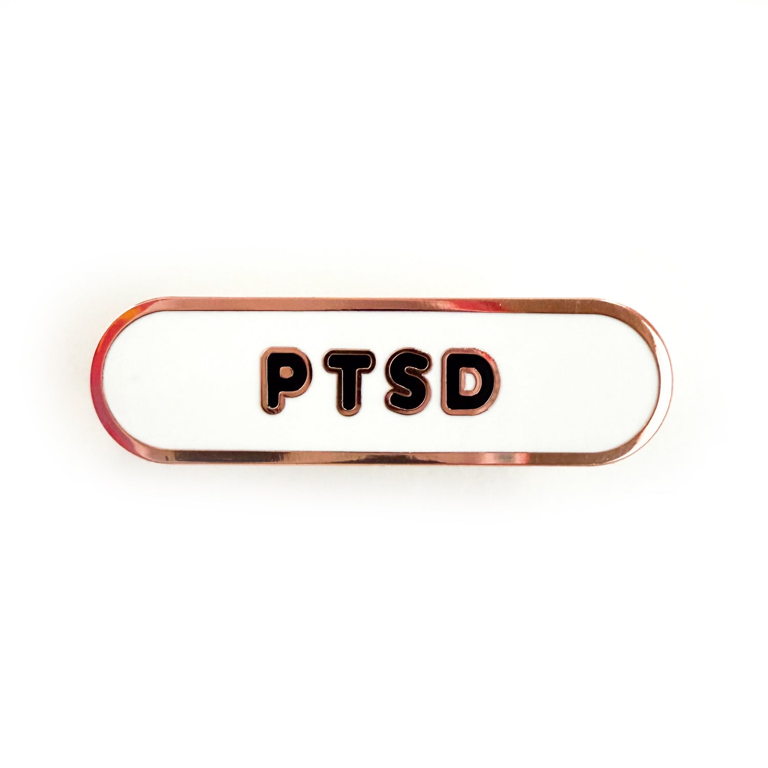 A bandaid shaped pin with the text PTSD in bubble letters. The background is white and the text is black.
