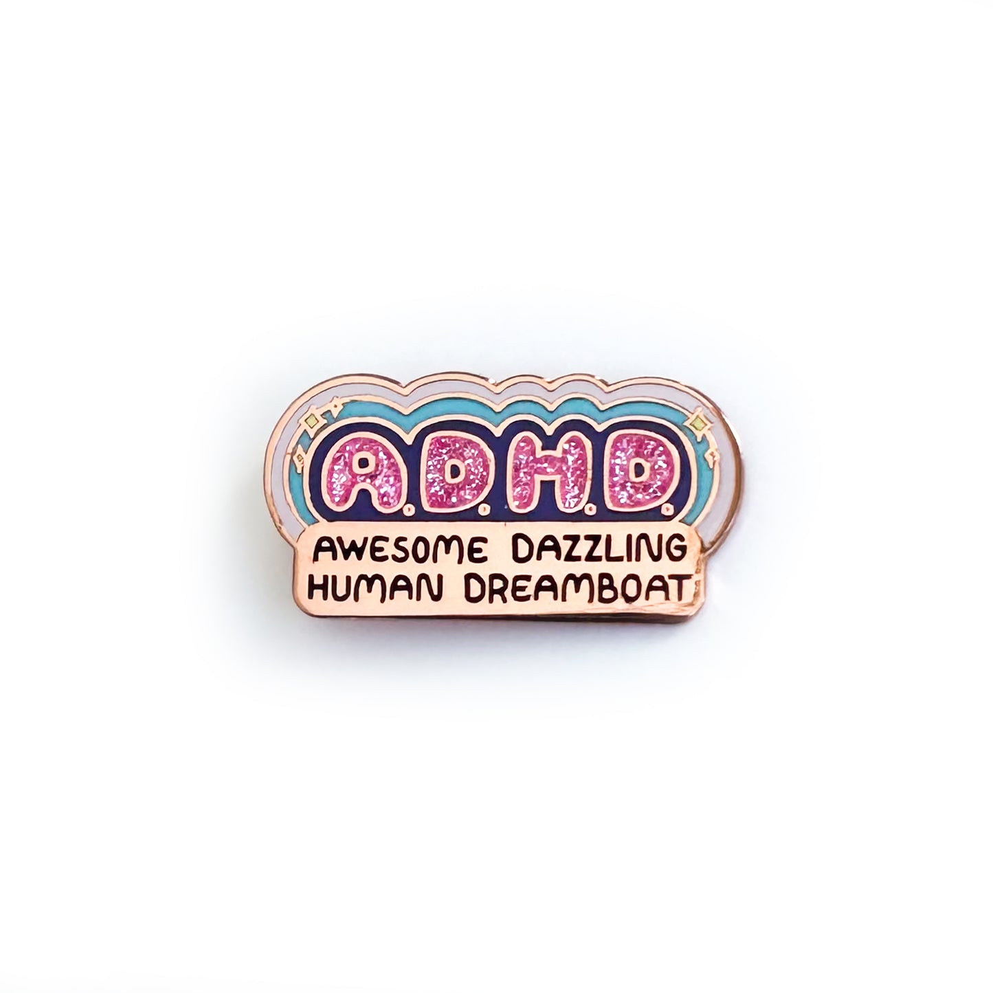 An enamel pin that reads "A.D.H.D. Awesome Dazzling Human Dreamboat" the ADHD letters are in sparkly pink enamel bubble letters with colorful rays and sparkles surrounding them. 