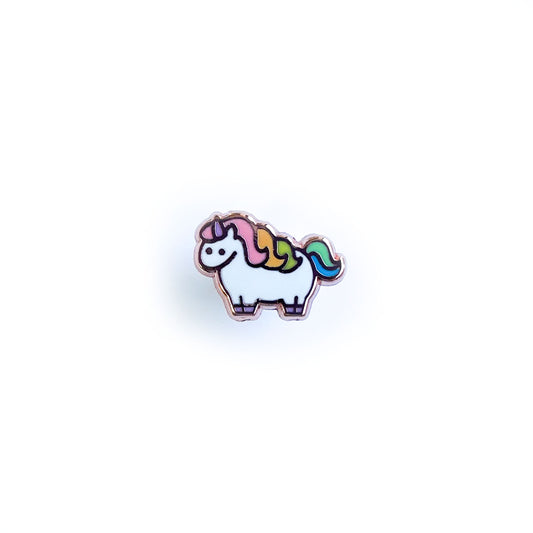 A mini enamel pin shaped like a cute illustration of a chubby unicorn with a pastel rainbow mane and tail.