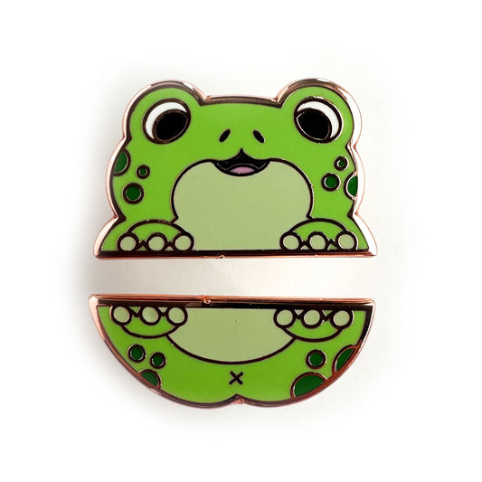 Two enamel pins that form the top and bottom half of a cute cartoony green frog with dark green spots.