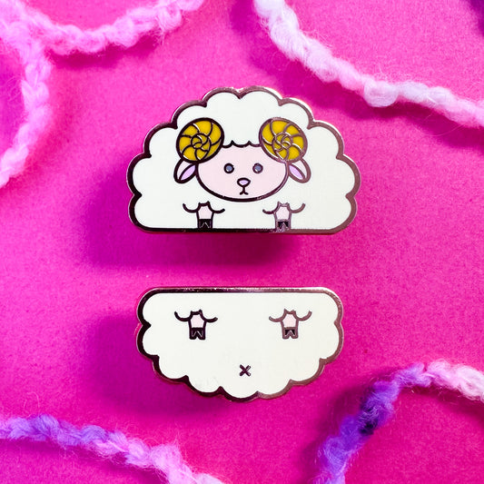 Two cute pins that come together to form a sheep. The pins are on a hot pink background with boucle yarn around it.
