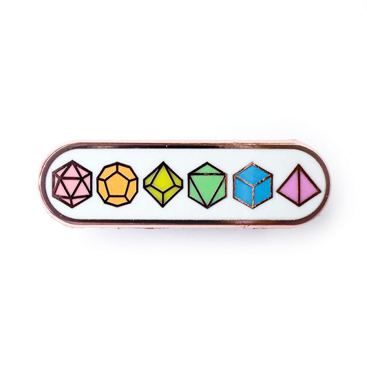 A bandaid shaped pin with illustrations of polyhedral dice on it in pastel rainbow colors.