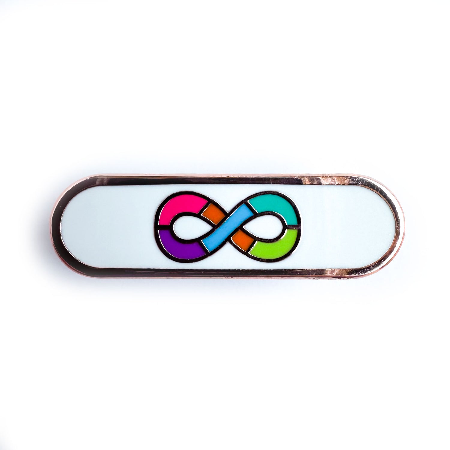 A capsule shaped pin with the rainbow infinity symbol of the neurodivergent pride flag on a white background. 