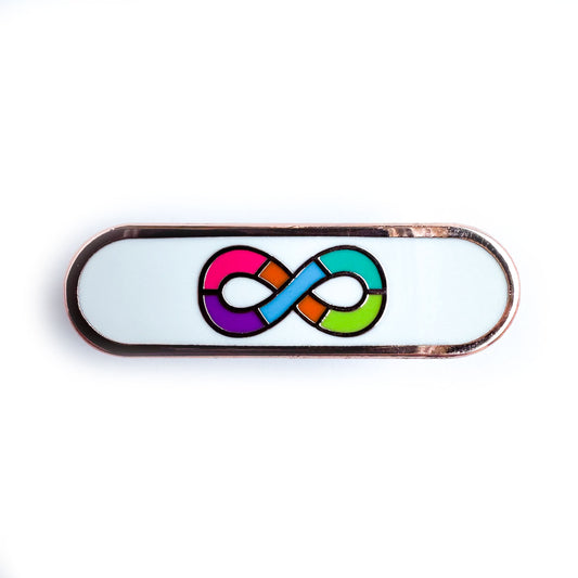 A capsule shaped pin with the rainbow infinity symbol of the neurodivergent pride flag on a white background.