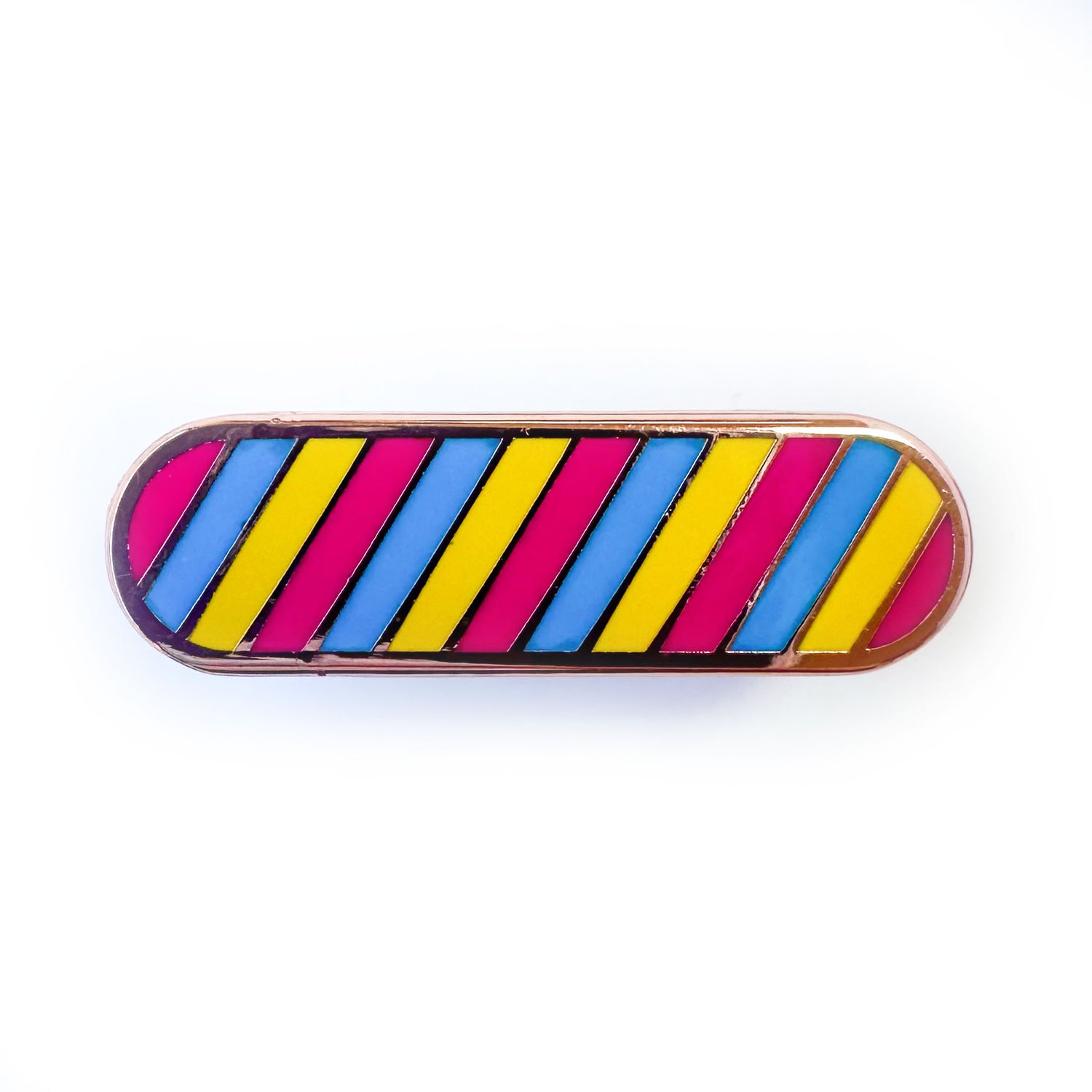 A capsule shaped pin with diagonal stripes in the colors of the Pansexual pride flag, hot pink, blue and yellow. 