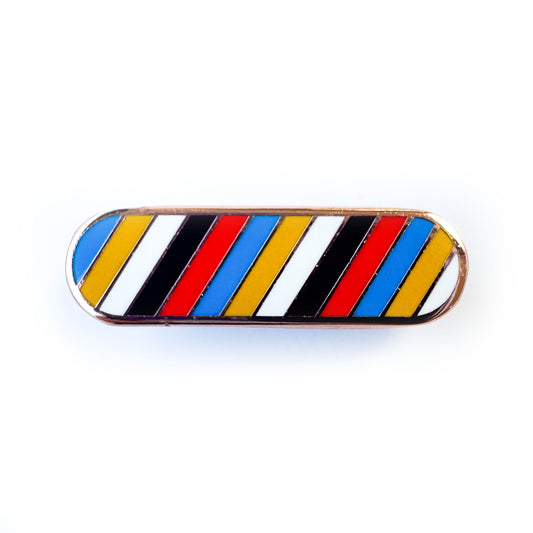 An oval shaped pin with diagonal stripes in the colors of the Polyamory Pride flag. 