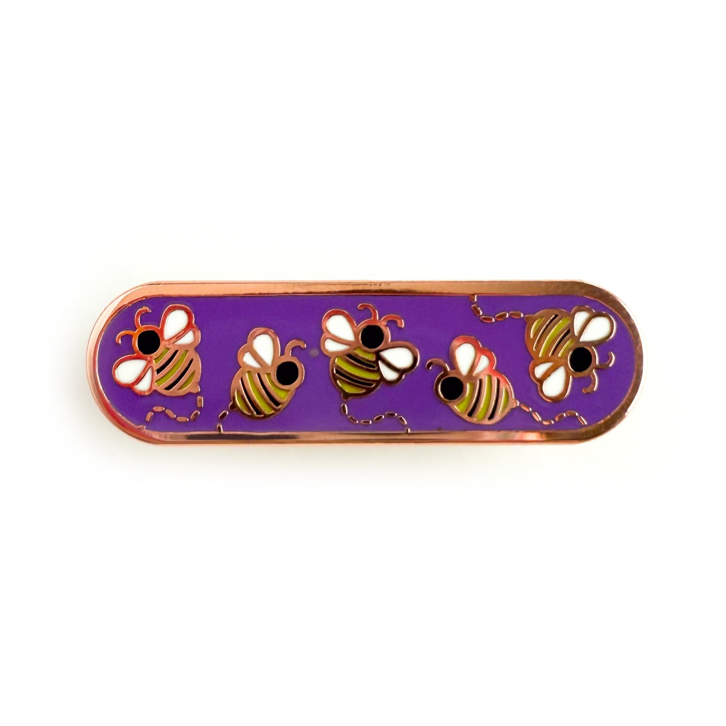 A bandaid shaped enamel pin with five little bees flying around. The bees are black, white, and yellow, while the background is purple, in reference to the non-binary pride flag.