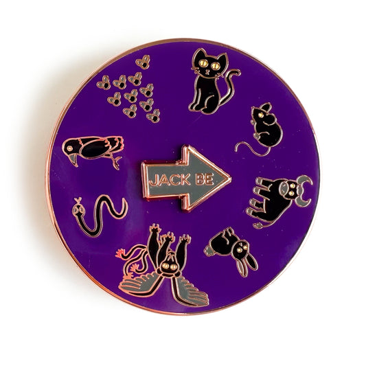 A round purple enamel pin with illustrations of black animals in a circle. There is a black cat, mouse, bull, rabbit, chimera, snake, raven, and swarm of flies. There is a spinning arrow in the middle of the circle that reads "Jack Be"