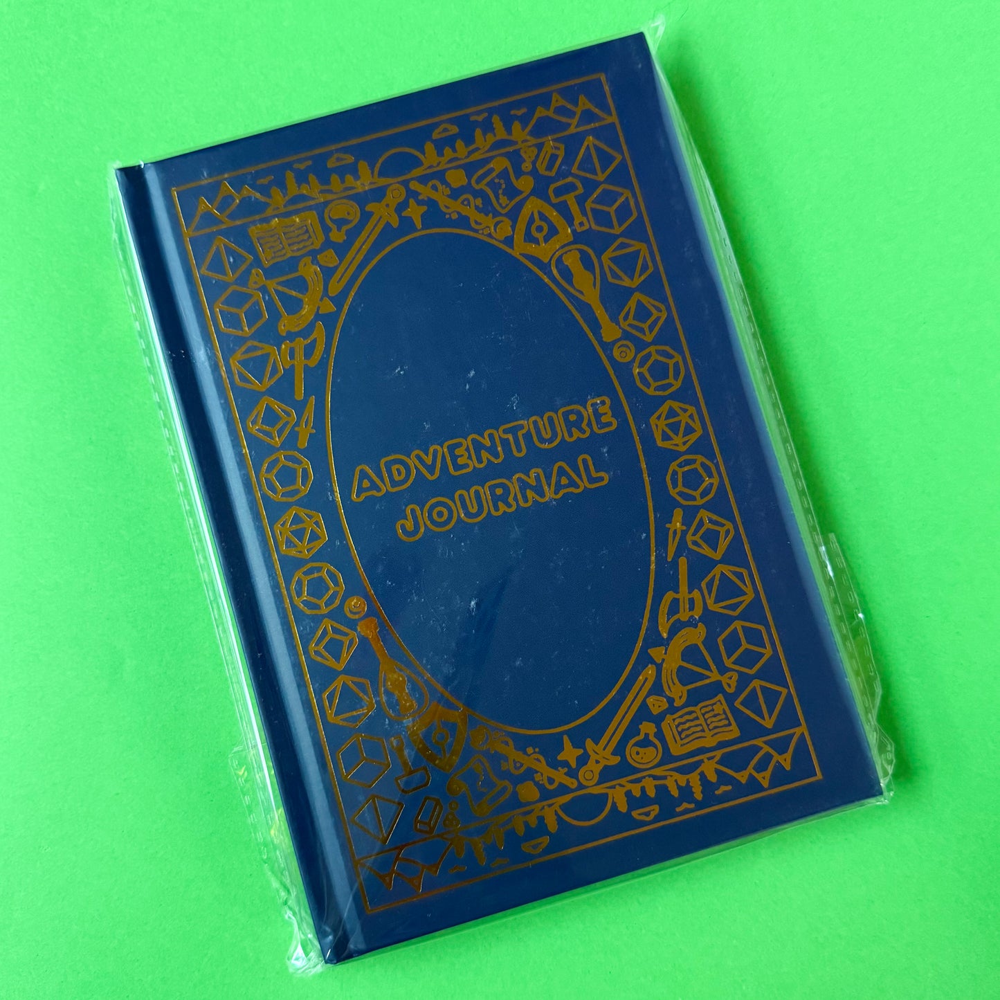 The Adventure Journal in a protective plastic covering.