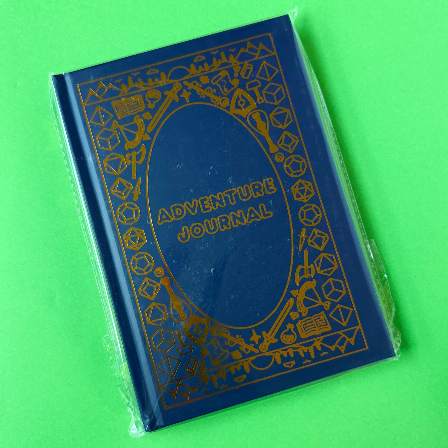 The Adventure Journal in a protective plastic covering.