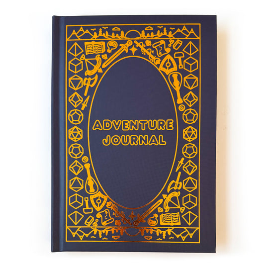 A dark blue hard cover notebook  with gold foil details. The title Adventure Journal in the center, surrounded by DND and fantasy themed illustrations. A few examples of these are dice, swords, potion bottles, lutes, and wands. There is a mountainous landscape along the top and bottom of the book. 