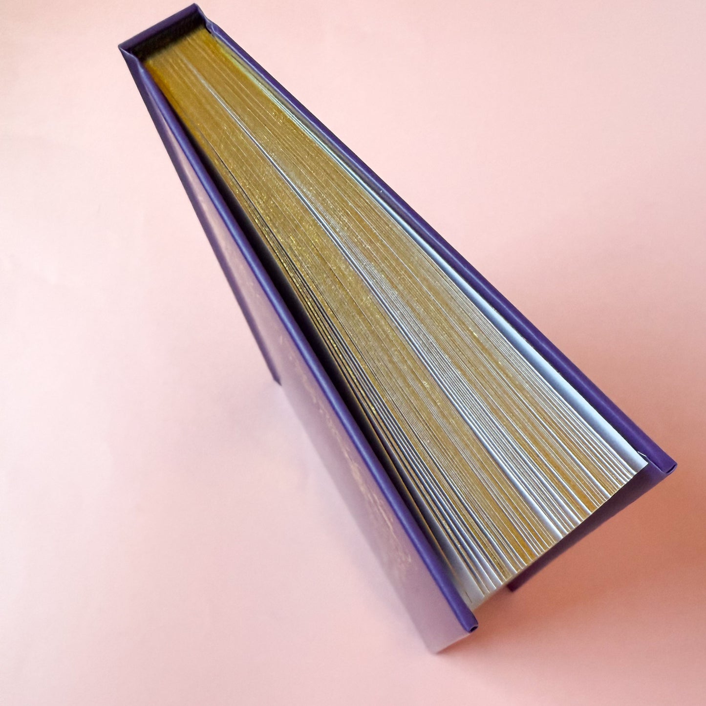 The edge of the Book of Spells, showcasing the gold edges of the page.