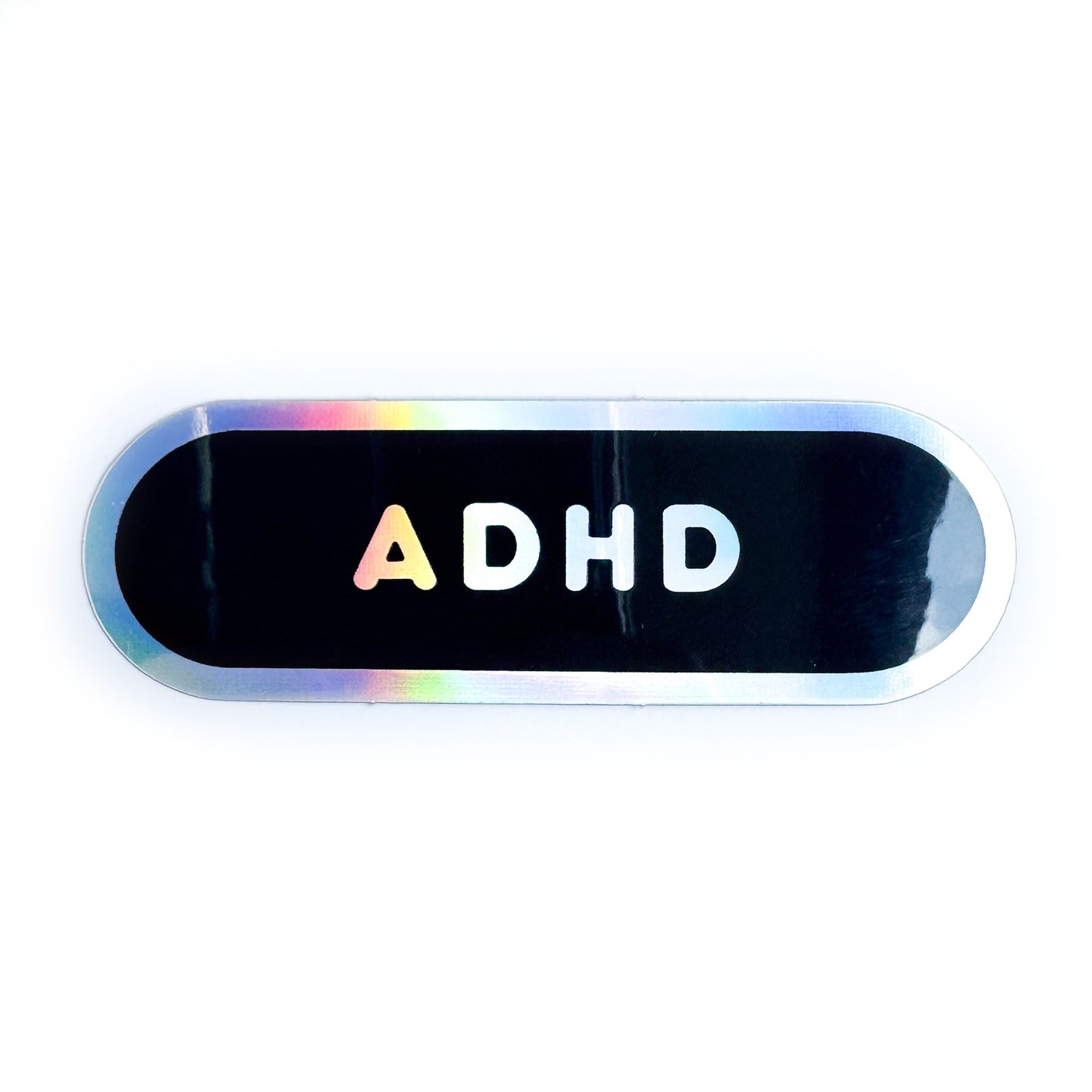 A black vinyl sticker with holographic border and holographic bubble letters reading ADHD.