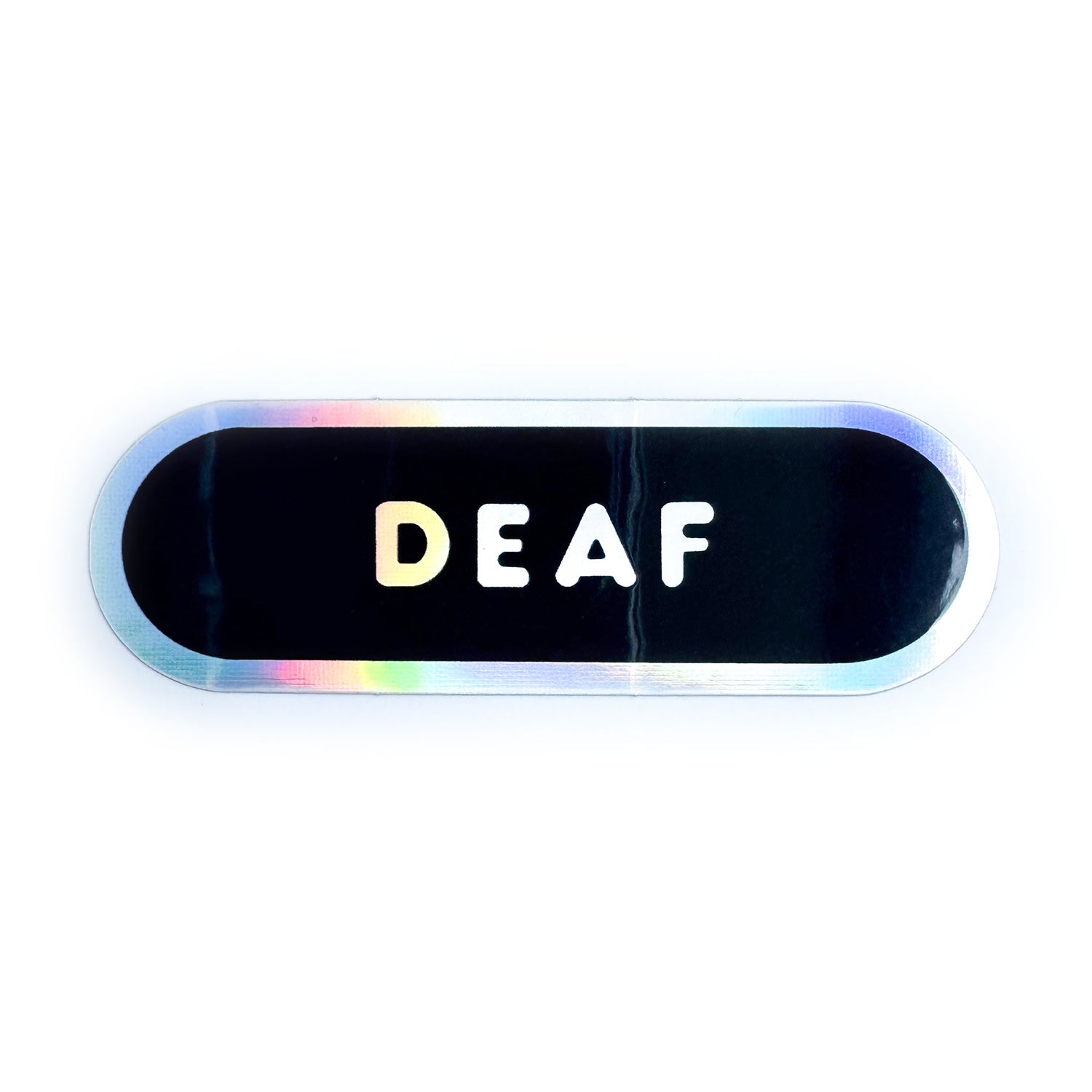 A black capsule shaped sticker with a holographic border and holographic bubble letters that read "Deaf." 