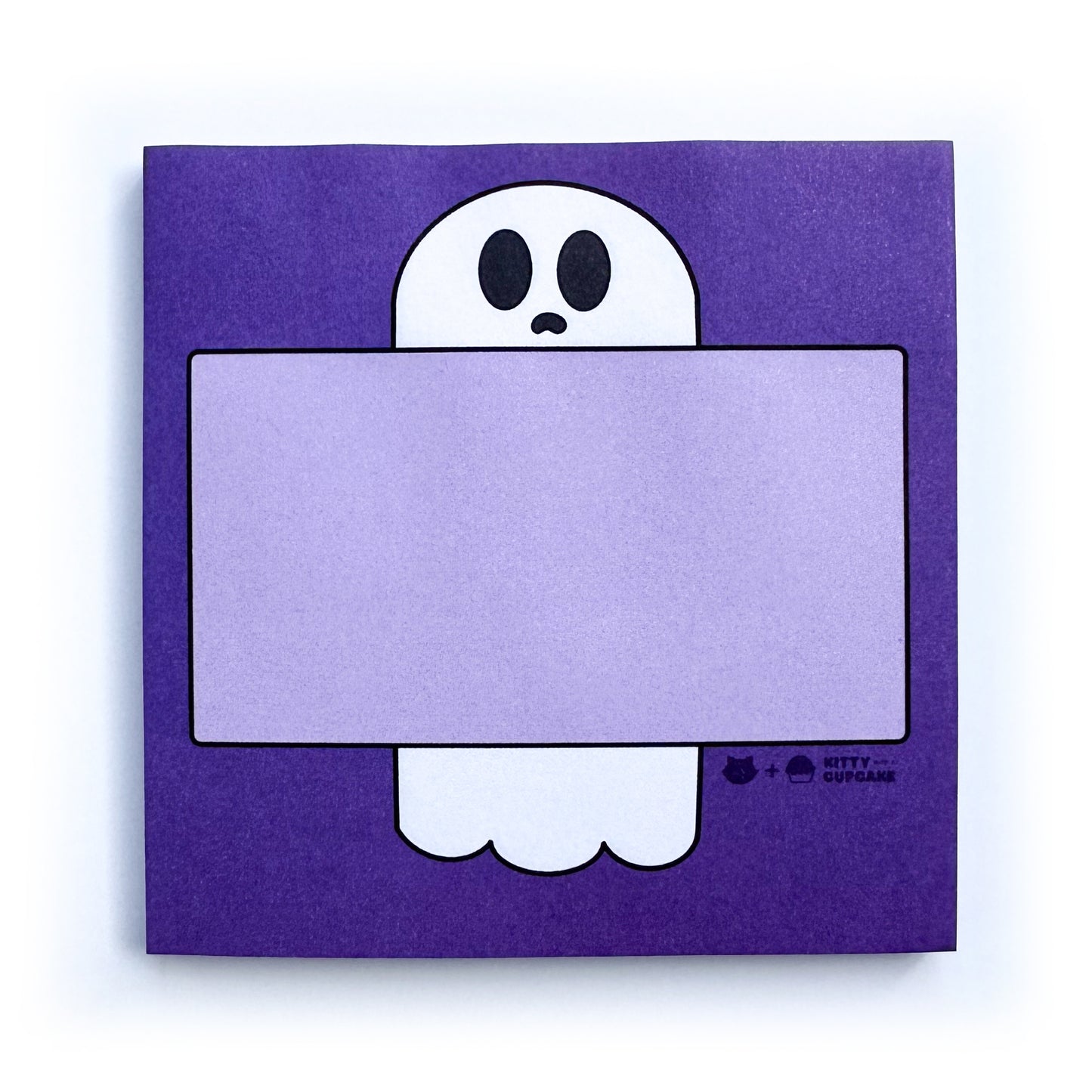 A purple square pad of sticky notes featuring a ghost holding a light purple box to write in.