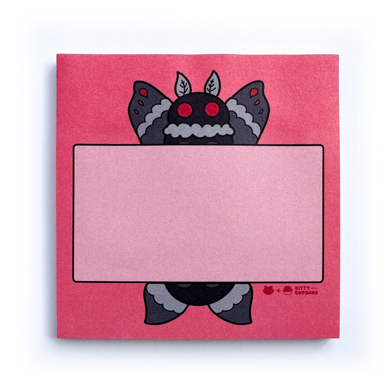 A red square sticky note pad featuring a cute illustration of Mothman holding a pink box for you to write in.