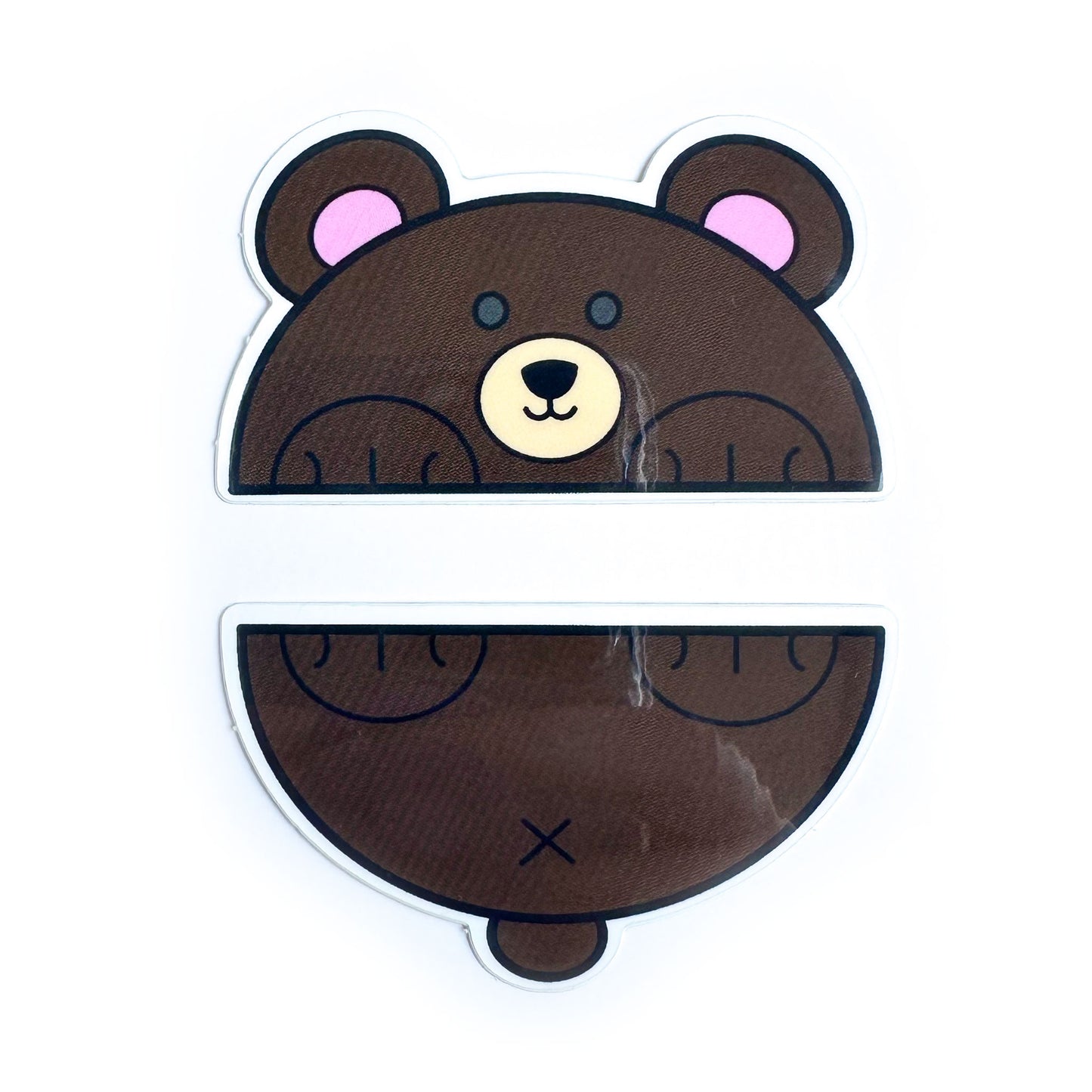 Two vinyl stickers that come together to form a bear that is cut in half horizontally. The top sticker is the bears's head and front paws and the bottom is the bear's tail bottom paws. 