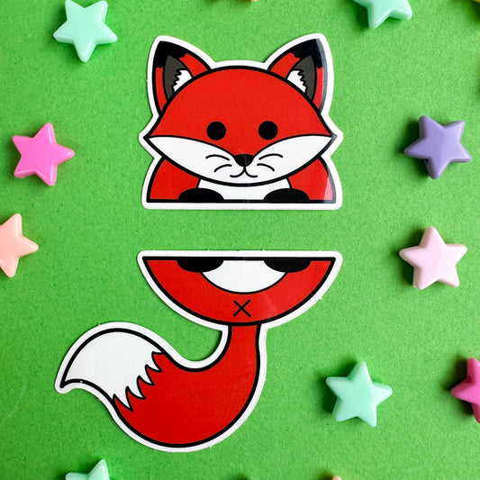 Two stickers that come together to form the top and bottom half of a red fox. The stickers are on a green paper background with pastel star beads around it. 