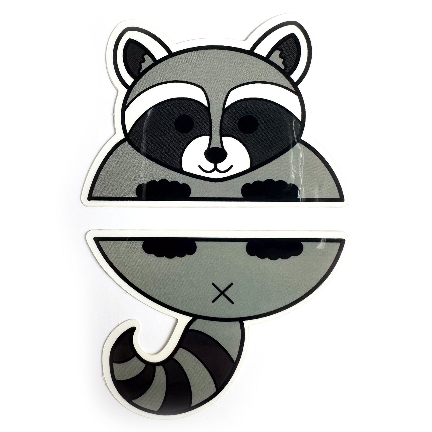 Two stickers that come together to form a cartoon illustration of a raccoon.