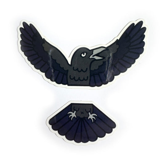 Two stickers that come together to form the top and bottom half of a Raven. One sticker is the wings and head the other is the feet and tail.