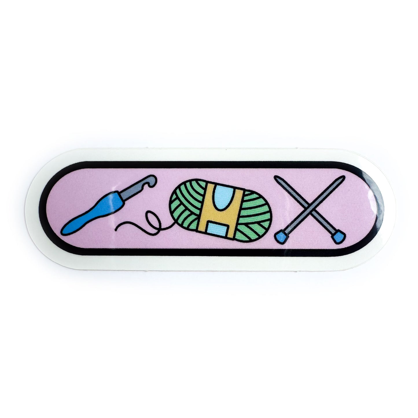 An oval shaped sticker with illustrations of a crochet hook, knitting needles, and a yarn ball on a pastel pink background. 