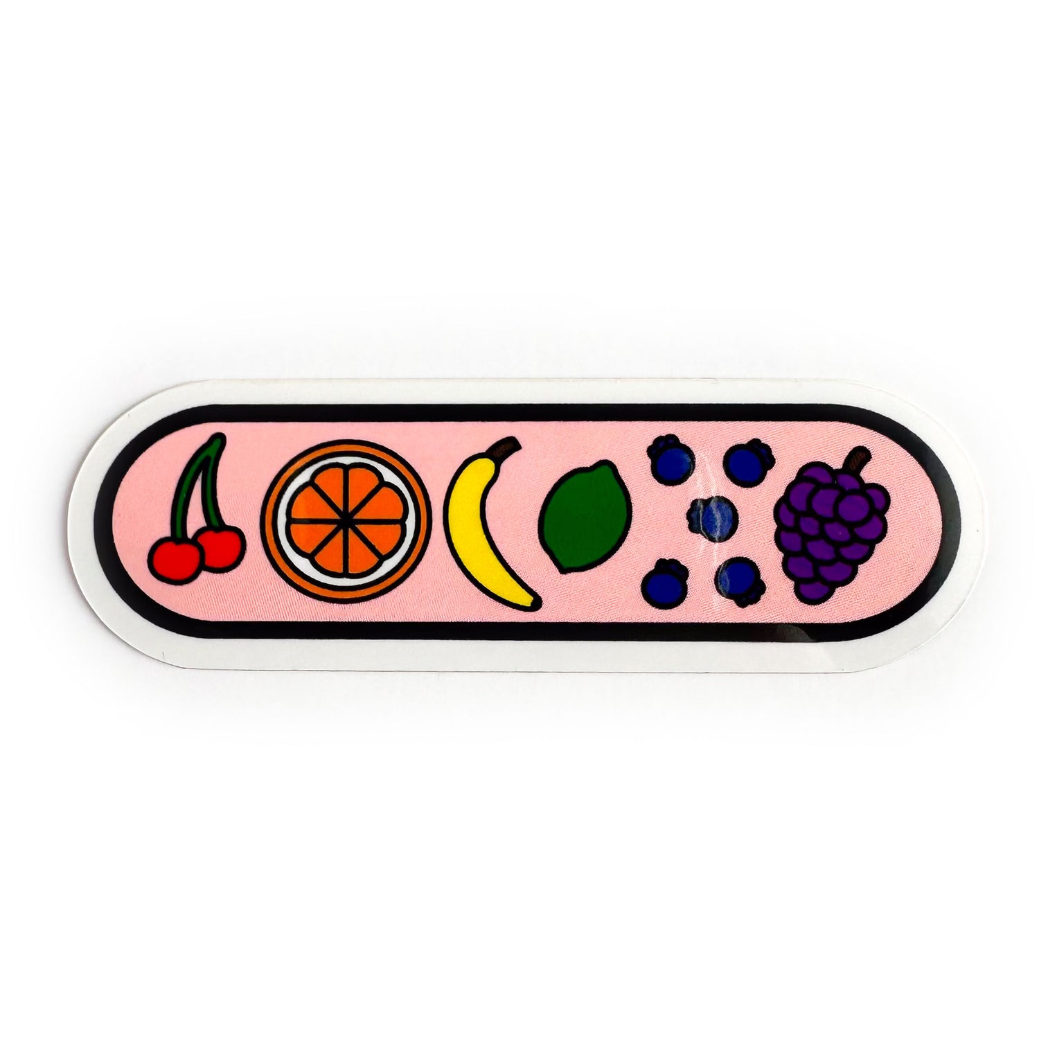 A capsule shaped sticker with illustrations of fruit on it, there is a cherry, orange, banana, lime, blueberries, and grapes. They are arranged in rainbow order. 