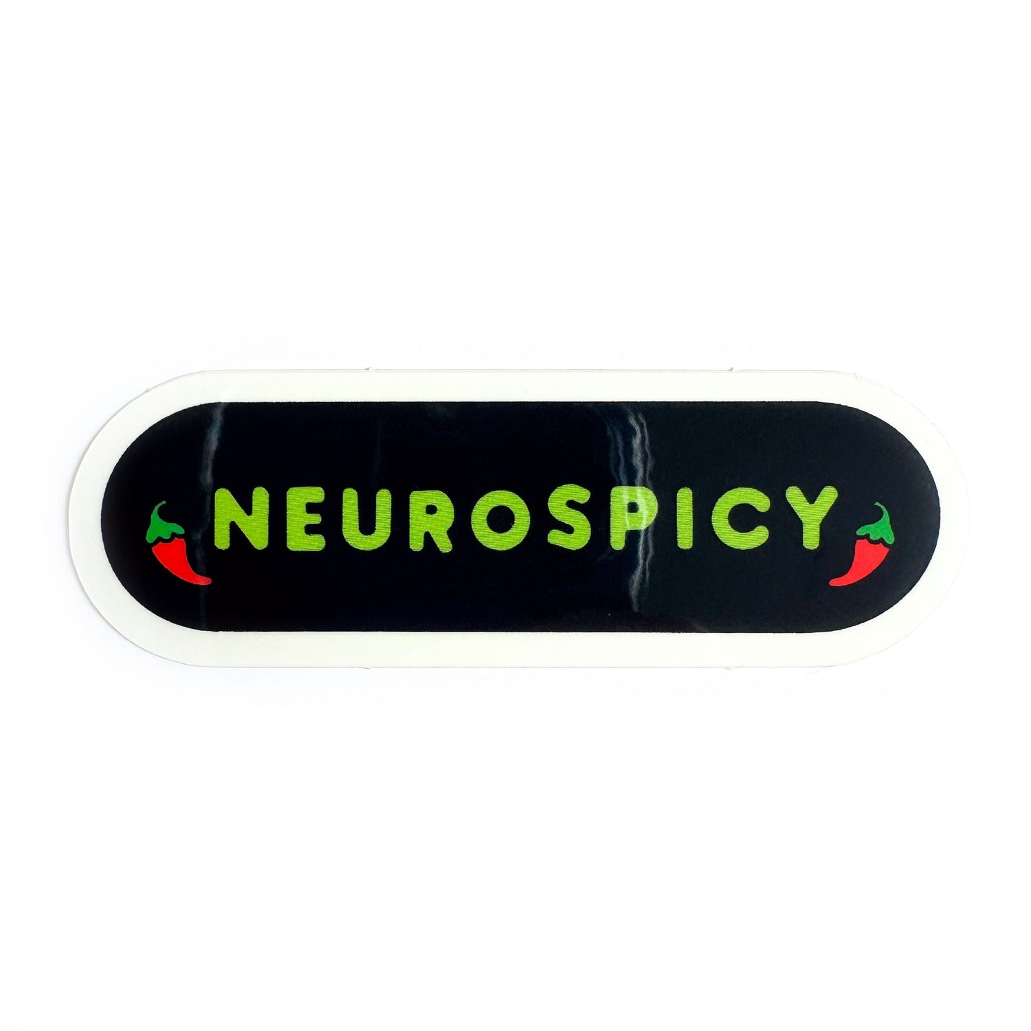 A black oval sticker with the word "neurospicy" on it with little chili pepper illustrations framing it. 
